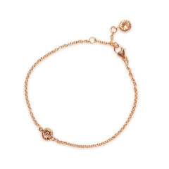 Knappkorall armband i guld, liggande