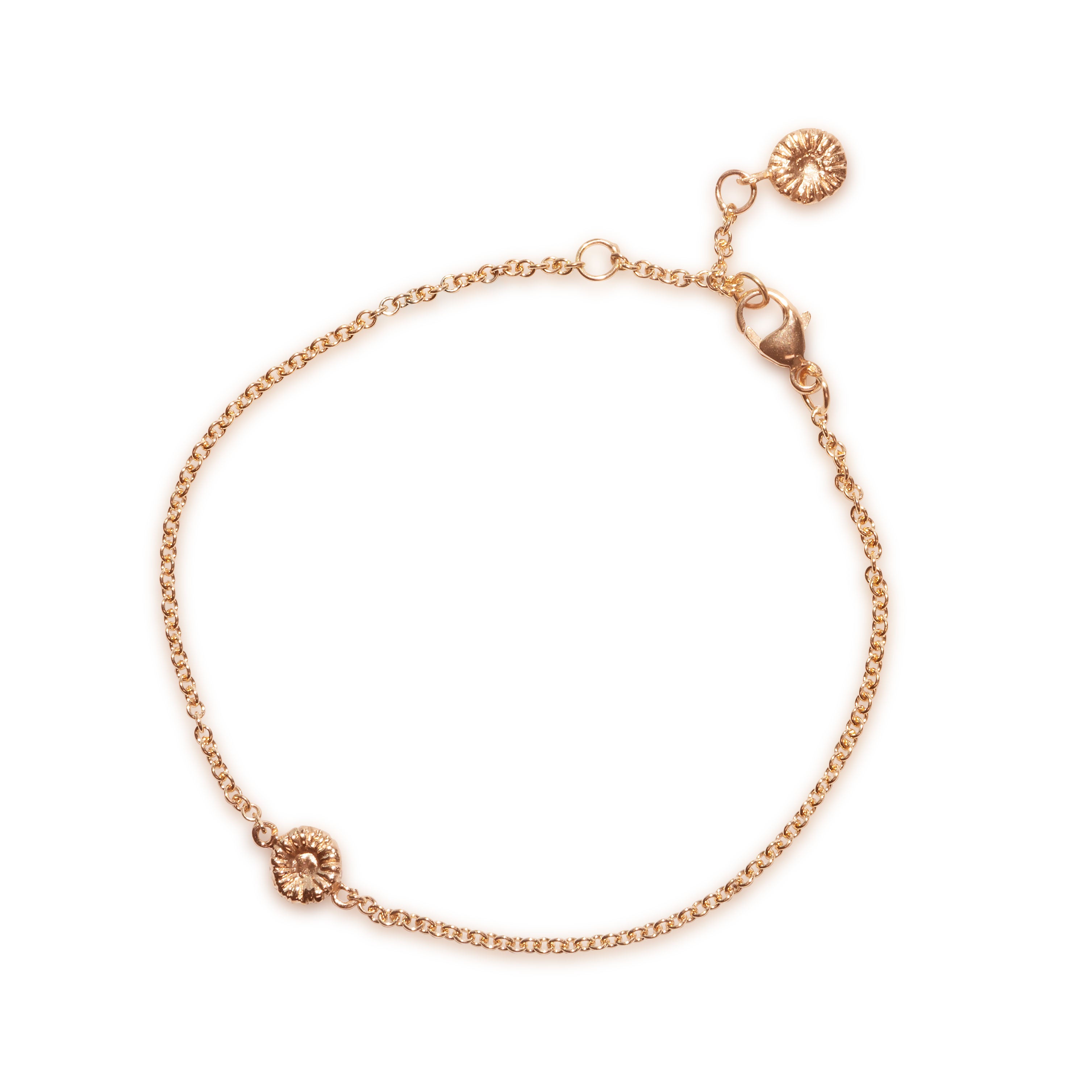 Knappkorall armband i guld, liggande